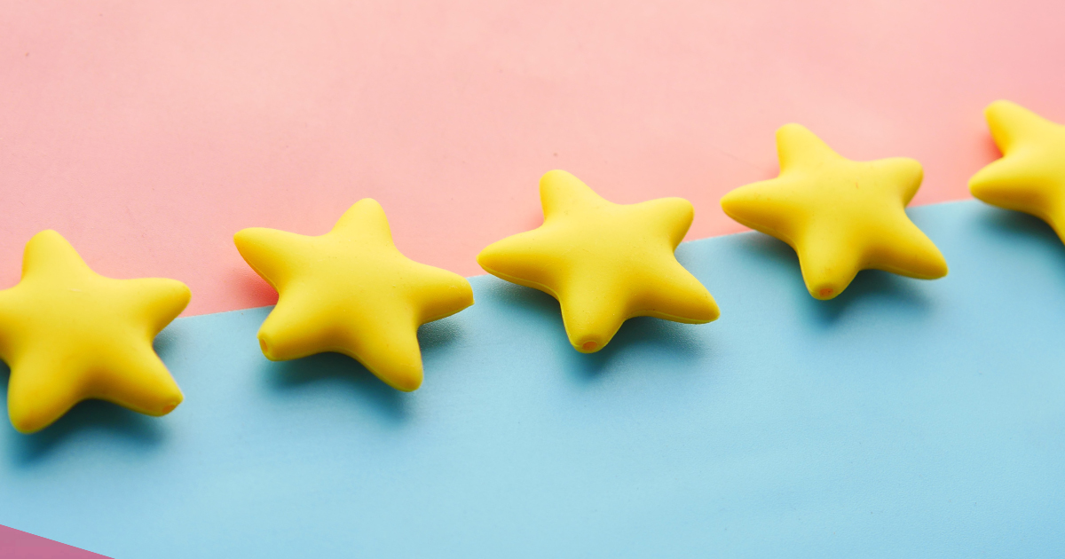 photo of 5 yellow stars on a pink and blue background